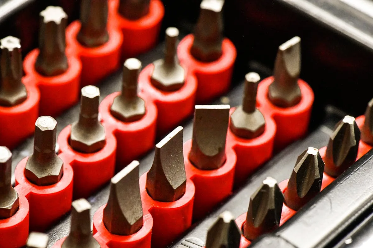 Red and yellow hand tools arranged on a table